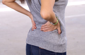 a woman suffering from a hip pain